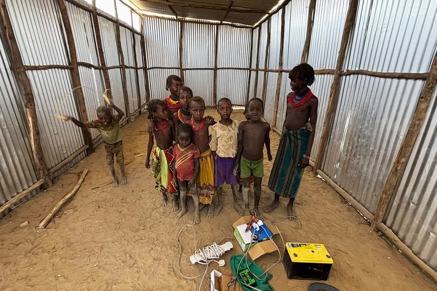 Children standing inside a newly built chapel